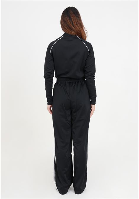 Firebird Loose black women's joggers with vertical stripes ADIDAS ORIGINALS | IT7404.